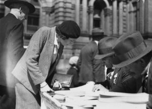 A woman at an outdoor voting area